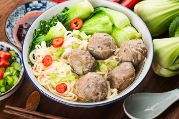 Chinese Food：Meatballs served with noodles,