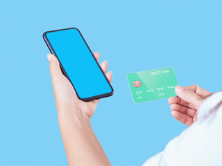 Woman with smartphone and credit card