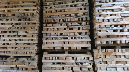 Neatly arranged pieces of teak wood are processed for the furniture industry