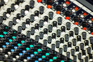 Close up of buttons and tabs of the audio controller in music festival in DJ booth