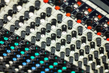 Obraz premium Close up of buttons and tabs of the audio controller in music festival in DJ booth