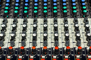 Close up of buttons and tabs of the audio controller in music festival in DJ booth