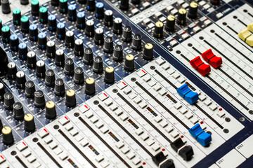 Close up of buttons and tabs of the audio controller in music festival in DJ booth