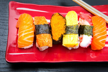 Close up of sashimi sushi set served on red plate