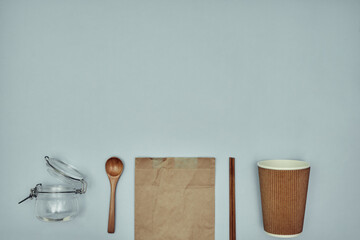 Disposable tableware. Plastic and sustainable materials. Copy space.