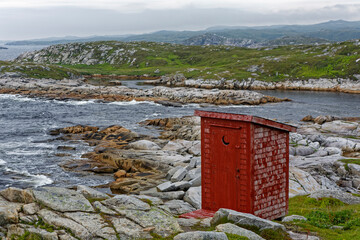 Traditional  red outhouse used in Newfoundland and Labrador, Canada.