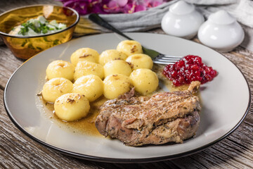 Roasted duck leg.