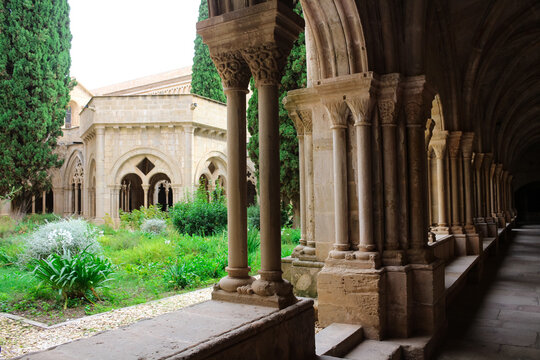 View of the courtyard from the vaulted galleries of the Poblet monastery (cat. Reial Monestir de Santa Maria de Poblet) Spain...