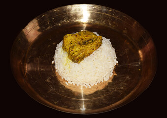 Bengali dish Mustard Hilsa Fish served on a brass pate