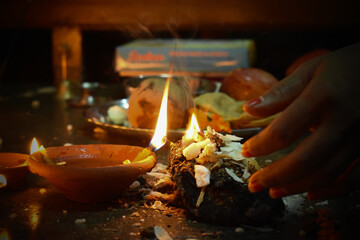 Beautiful traditional lamps lit up in a line on the occassion of Diwali festival in India