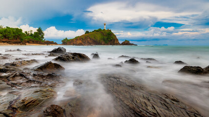 The Lighthouse with rock used long exposure photography at Lanta island, Krabi, Thailand