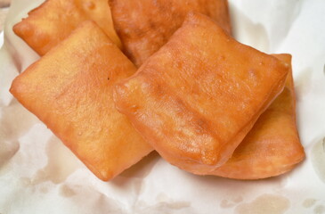 Chinese pastry dough on white paper in plate