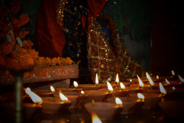 Beautiful traditional lamps lit up in a line on the occassion of Diwali festival in India