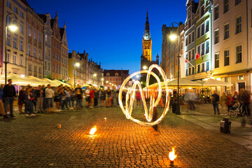 Fire dance at the Long Market in Gdańsk at dusk, Poland © Patryk Kosmider