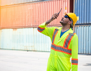 Inspection engineer using radio communication for communication to control the transportation of...