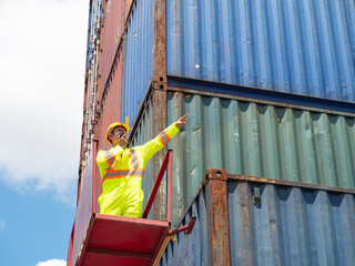 Inspection engineer using radio communication for communication to control the transportation of products through containers on the job site..