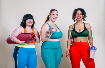 Plus size women making sport and fitness.