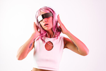 Young woman with pink hair dancing and having fun