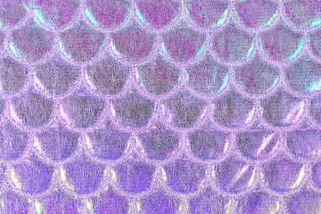 Background with pink shiny textile fabric with mermaid fish scales © Firn