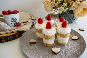 Cheesecake cupcake with raspberry on top.