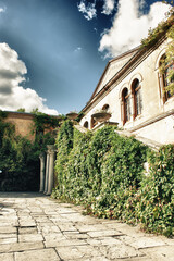 The courtyard of an old house in a surreal style.