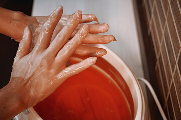 paraffin therapy for hands with wax