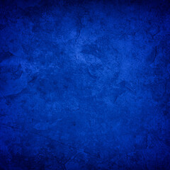 Blue background with texture and distressed vintage grunge in elegant sapphire color backdrop...