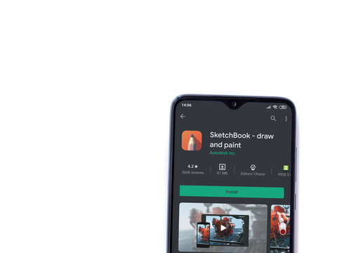 Lod, Israel - July 8, 2020: Autodesk SketchBook - draw and paint� app play store page on the display of a black mobile smartphone isolated on white background. Top view flat lay with copy space.