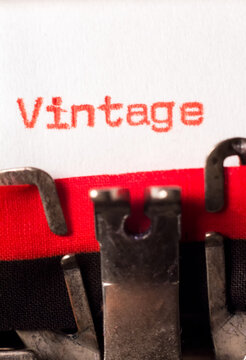 Vintage word typed on typewriter on red