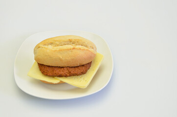 Cheeseburger on white Plate, isolated on white Background