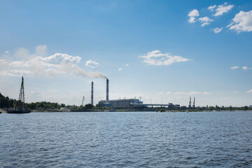 Fototapeta na wymiar Coal mining. Coal mine. Natural heaps of industrial coal. View from the river.
