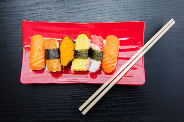 Sashimi sushi set served on the red plate