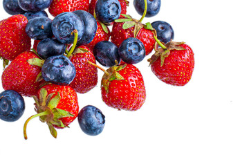 Fototapeta na wymiar Fresh summer blueberry and strawberry heap, isolated