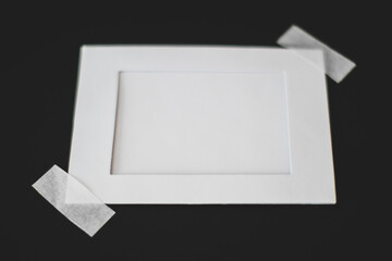 Cardboard photo frame on black background