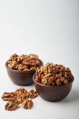 Walnut kernels on a wooden background.
