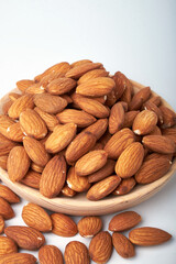 nuts almonds in a Cup on a white background