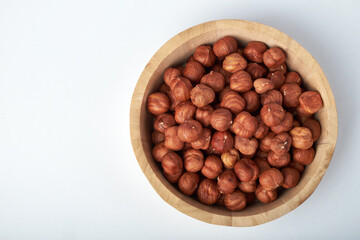 hazelnuts in a Cup on a white background