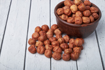 hazelnuts in a Cup on a wooden background