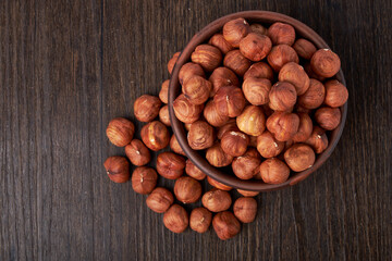 hazelnuts in a Cup on a wooden background