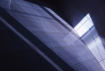 Fototapeta premium Abstract light rays on office tile background