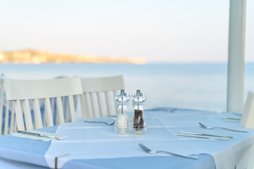 cafe tables on the sea mediterranean embankment. selective focus