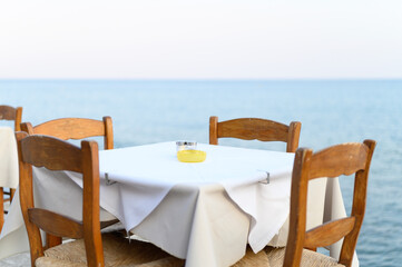 cafe tables on the sea mediterranean embankment. selective focus