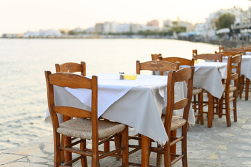 cafe tables on the sea mediterranean embankment. selective focus