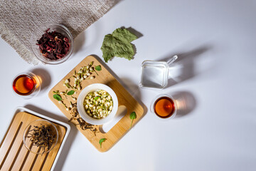 Chinese tea party. Dry granules of different types of tea. Flatlay, top view. herbal tea, on a...