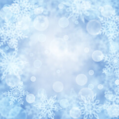 Naklejka na ściany i meble Christmas background of blurry snowflakes in light blue colors