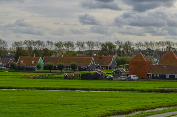 Fototapeta na wymiar Countryside of netherlands. This is a region with canals, farms and windmills.