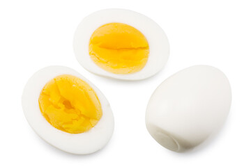 Single whole boiled egg with halved egg isolated on a white background. Top view