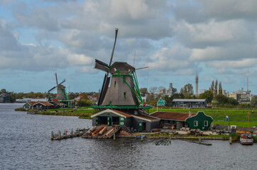 Naklejka premium Windmills around Zaanse Schans village at north of Netherlands.