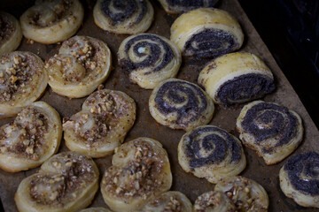 Freshly made curls stuffed with poppy and walnuts. Lie on a baking sheet.