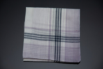 white handkerchief with lines on the black background
